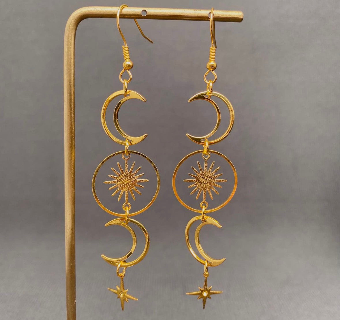 Golden Hollow Moon Star Dangle
Earrings
